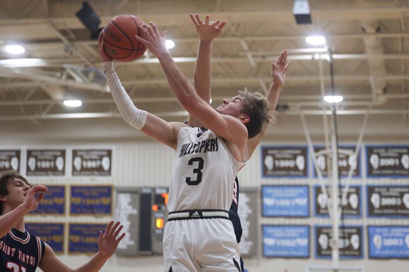 Joliet Catholic’s Tyler Surin goes in for the layup against St. Viator.