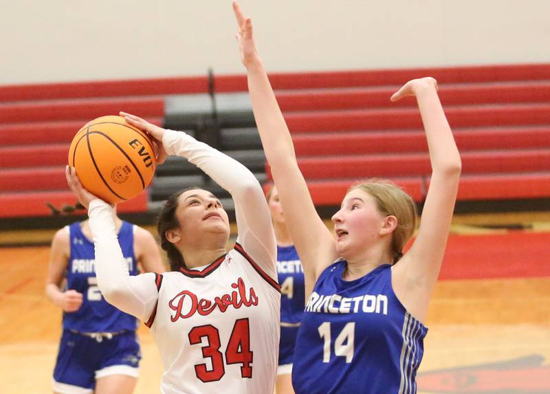 Hall's Natalia Zamora eyes the hoop as Princeton's Payton Brandt defends on Monday, Jan. 6, 2025 at Hall High School.