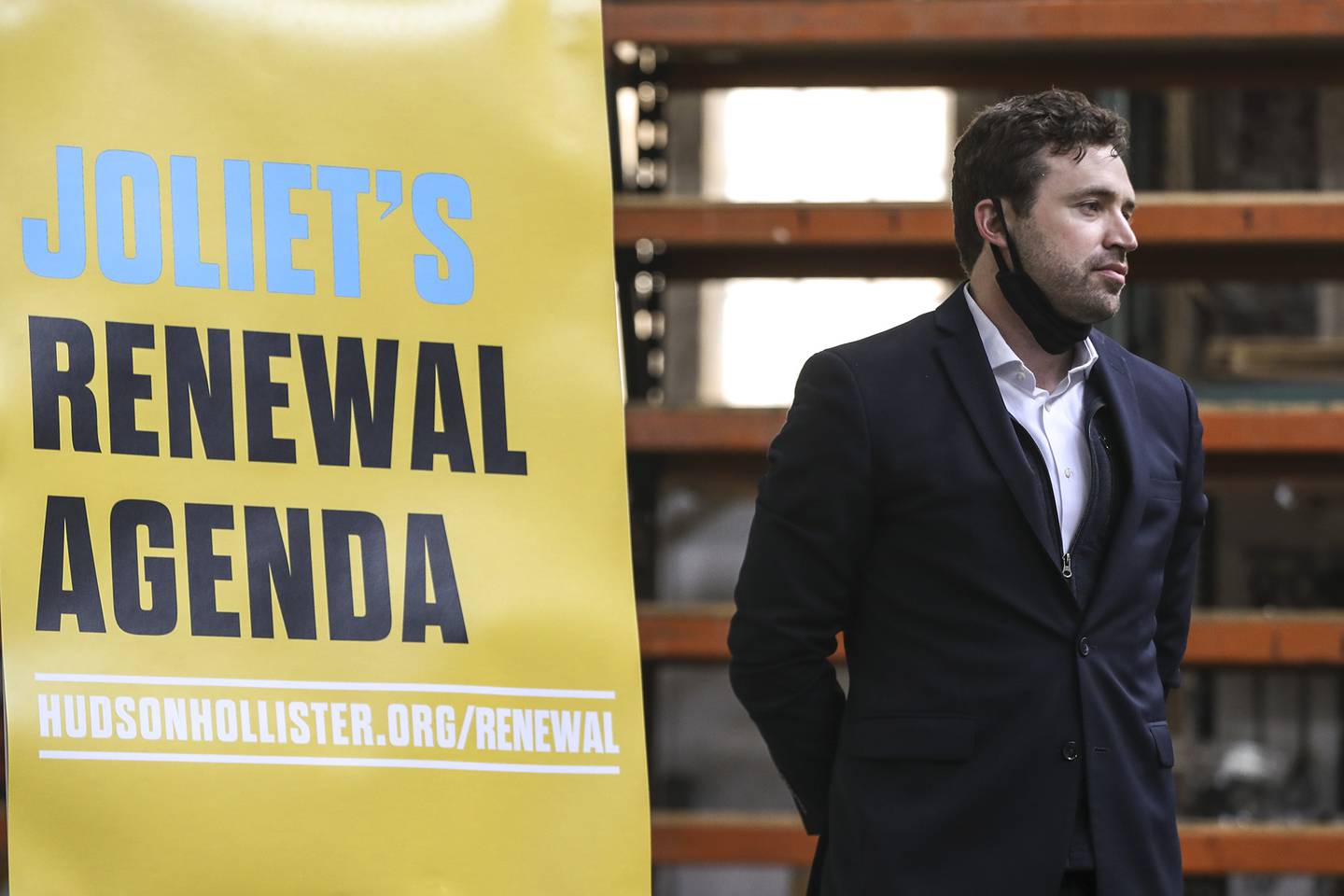 Candidate for Joliet City Council Hudson Hollister awaits the start of a campaign event on Monday, Feb. 22, 2021, at Barrett's Industrial Supply in Joliet, Ill.