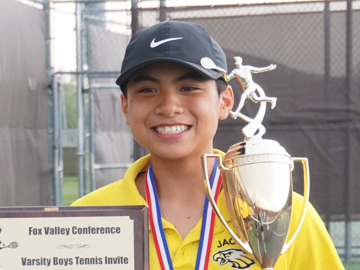 Jacobs freshman Samuel Santa Ines celebrates after the Golden Eagles won the Fox Valley Conference Tournament.