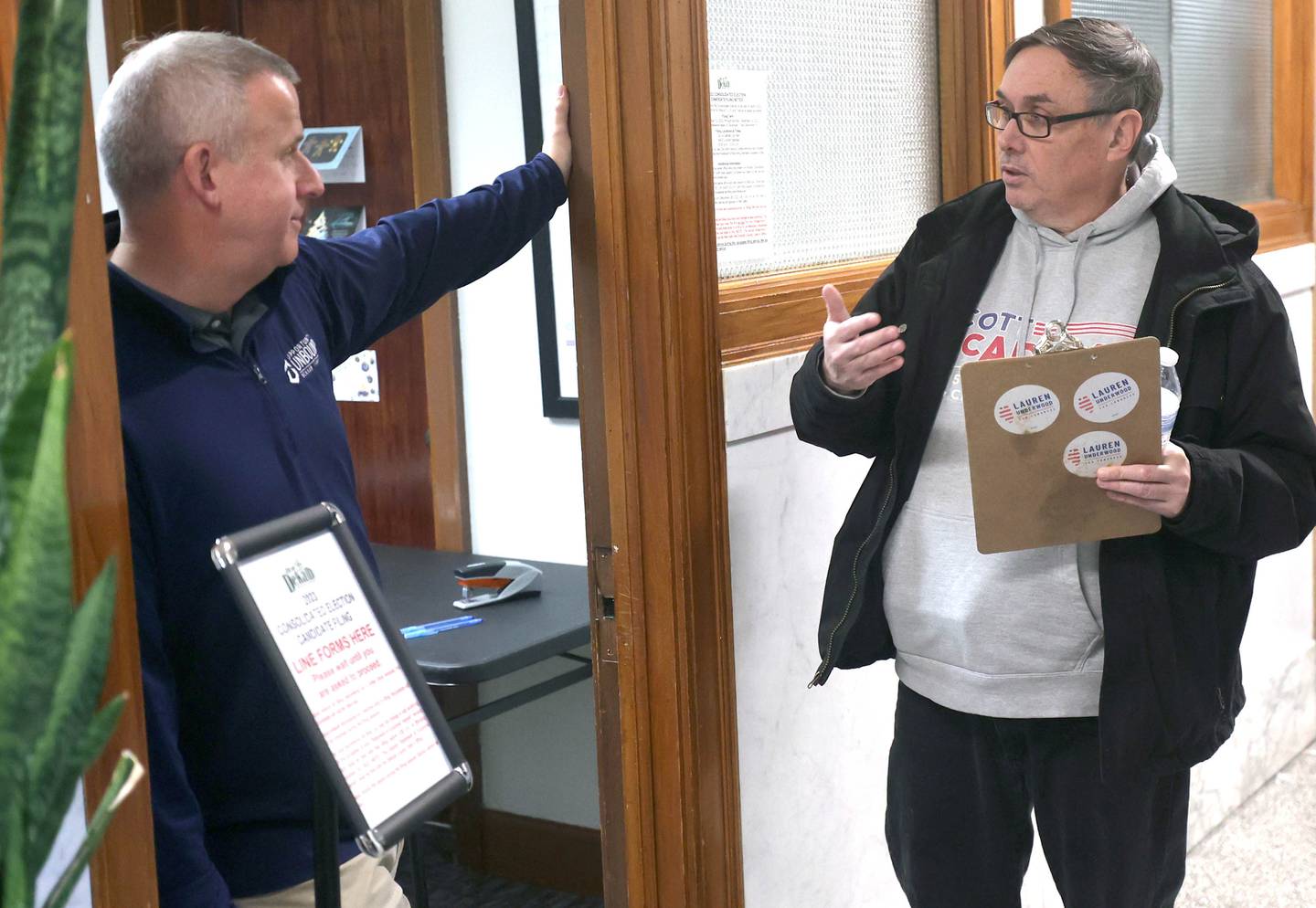 DeKalb City Council Ward 5 alderman Scott McAdams talks to mayor Cohen Barnes Monday, Dec. 12, 2022, at City Hall. McAdams, who is running for re-election, was among the first candidates in line Monday at 8:30 a.m. when filing opened at City Hall.