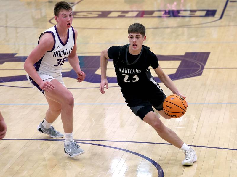 Kaneland's Connor Kimme pushes the ball by Rochelle's Eli Schweitzer Tuesday, Feb. 3, 2026, in their game at Rochelle High School.