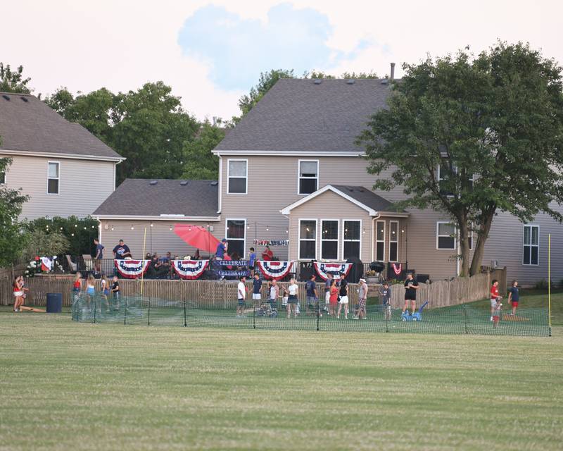 A home near Prairie Point Community Park in Oswego enjoys some back yard festivities and Fourth of July decor before the start of the fireworks on Thursday July 4, 2024.