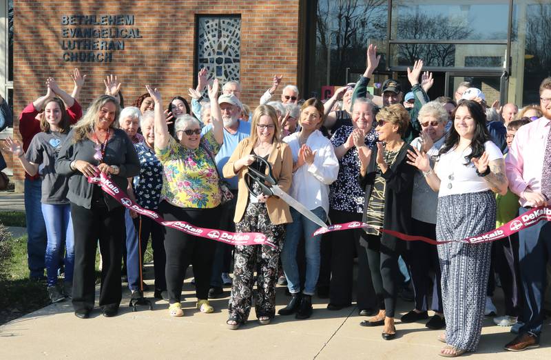 Tynisha Clegg, executive director of Family Service Agency, along with representatives from the city as well as staff and patrons of Club 55 cut the ribbon Monday, April 10, 2023, at the new location of Family Service Agency’s Club 55 in DeKalb. The senior center is celebrating its grand reopening in its new location at Bethlehem Lutheran Church, 1915 North First Street, in DeKalb.