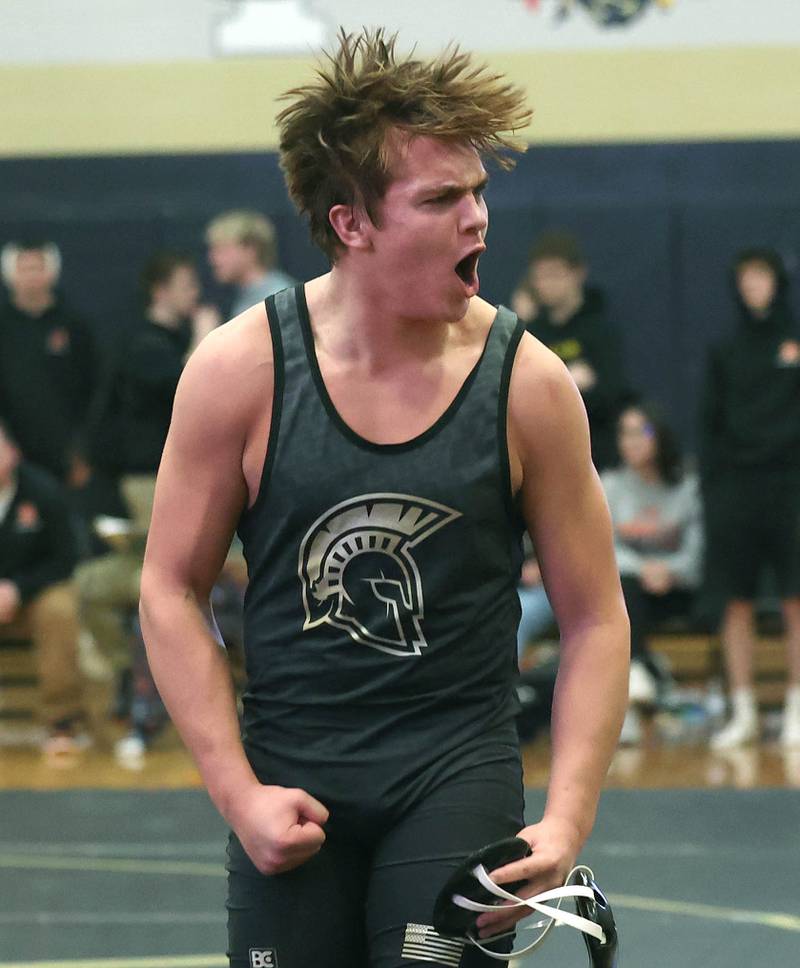 Sycamore’s Peter Gehrig celebrates after his major decision over DeKalb’s Darius Russell in their 190 pound match Friday, Jan. 16, 2026, at Sycamore High School.