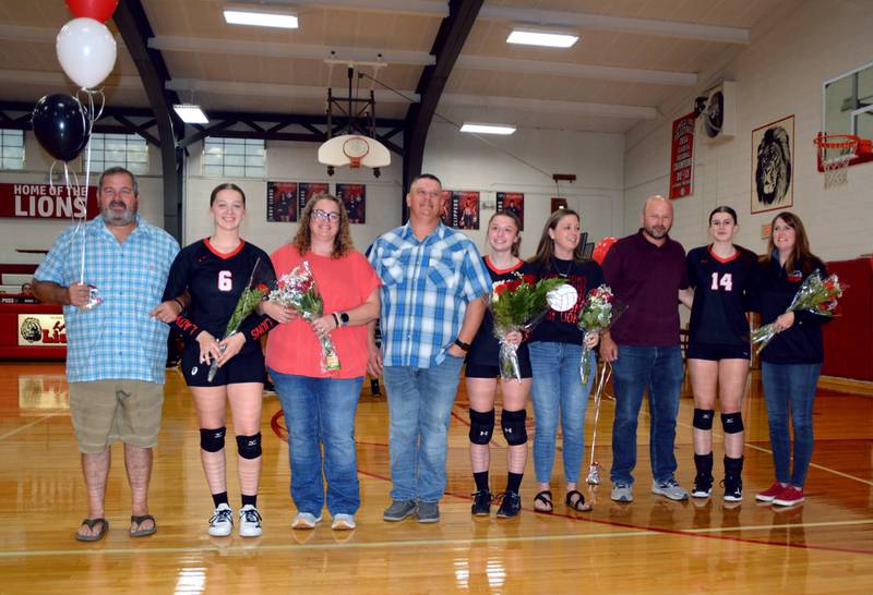 LaMoille High School recognized its senior volleyball players Sadie Quest, Oliviia Sadnick and Claire Lovgren and their parents on Senior Night Thursday. Pictured are (from left to right) Kevin, Sadie and Karin Quest, Jason, Olivia and Tori Sadnick, and Eric, Claire and Robin Lovgren.