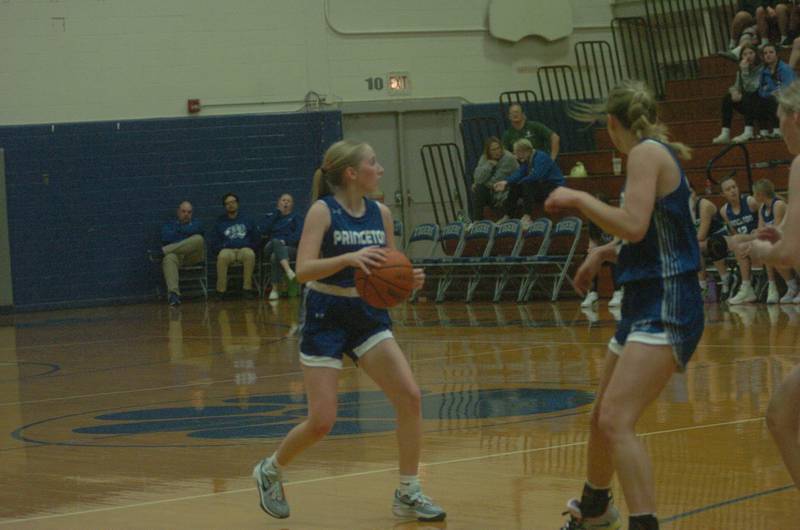 Princeton's Paige Jesse (4) looks to pass in Saturday's championship game of the Princeton Holiday Tournament against Erie-Prophetstown.