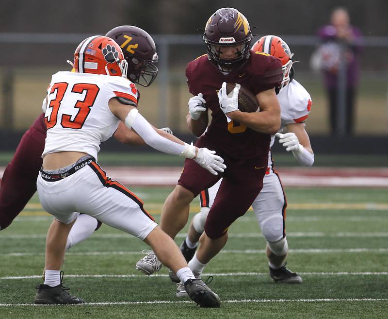 Richmond-Burton's Hunter Carley looks for running room against Byron\s Ben Lively  during an IHSA Class 3A semifinal playoff football game on Saturday, November 22, 2025, at Richmond-Burton High School, in Richmond.