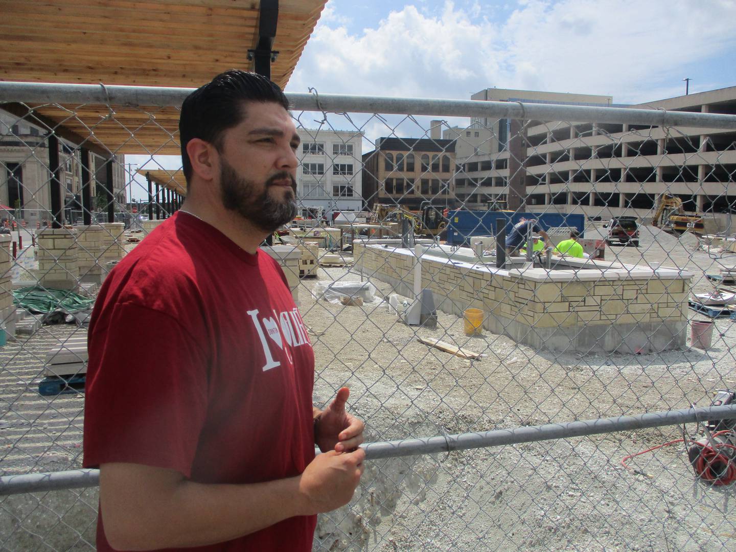 Joliet City Center Partnership Executive Director Emmanuel Lopez looks over the new city square under construction in downtown Joliet. Aug. 15, 2025