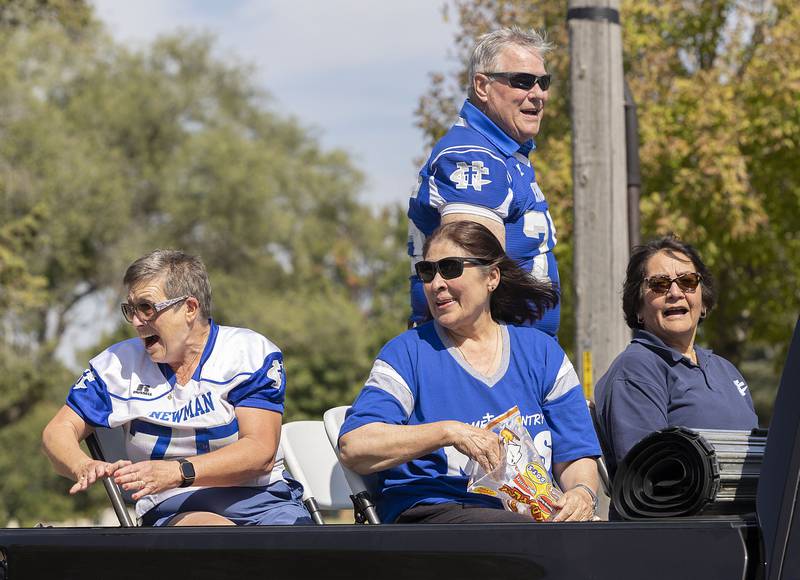 Members of the NHS Class of 1975 ride through the Newman High School parade Friday, Sept. 12, 2025, in Sterling.