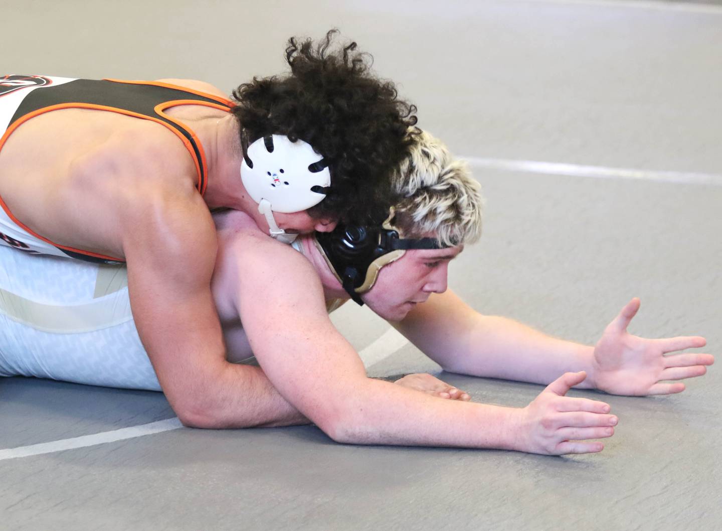 Sandwich's Alex Alfaro controls Sycamore's Gable Carrick on Saturday, Jan. 22, 2022, in the Interstate Eight Conference Meet at Kaneland High School in Maple Park.