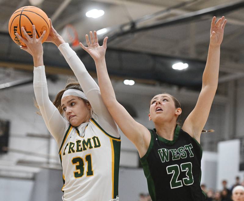 Fremd’s Bella Del Mar, left, grabs a rebound in front of Glenbard West's Mya Austin during the Hersey Class 4A supersectional at Forest View Education Center on Monday, March 3, 2025 in Arlington Heights.
