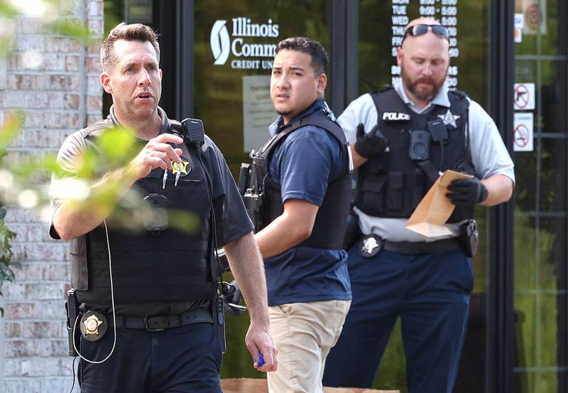 DeKalb Police officers work outside the Illinois Community Credit Union Wednesday, July 31, 2024, as they investigate a morning bank robbery in the facility at 1500 Barber Greene Road in DeKalb.