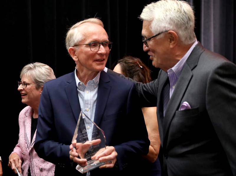 Mark Koenen (left), 2024 Charlemagne Award winner, greets former St. Charles Mayor Ray Rogina during the 56th Annual Charlemagne Awards Dinner hosted by the St. Charles Chamber of Commerce at the Q Center in St. Charles on Friday, May 17, 2024.