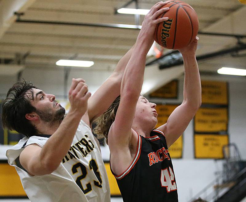 Roanoke-Benson's Zeke Kearfott grabs a rebound over Putnam County's Jackson McDonald during the Tri-County Conference Tournament on Tuesday, Jan. 24, 2023 at Putnam County High School.