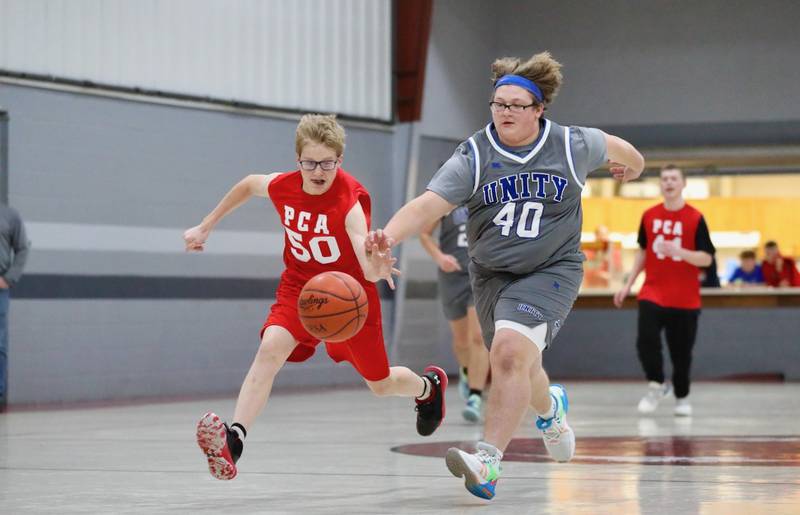 Princeton Christian Academy's Trustin Crew tracks down a loose ball against Fulton Unity Christian Thursday night at PCA's Howard Hoffman Gym. PCA won 39-35.