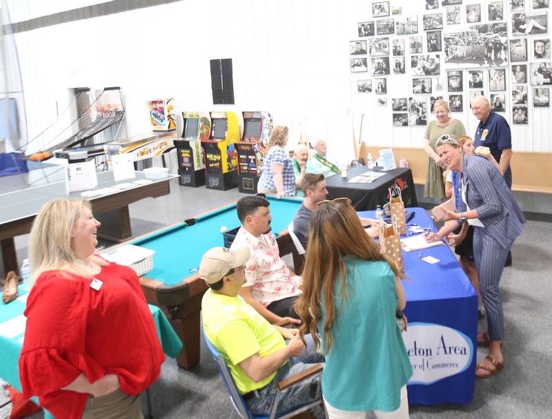 Attendees sign in during the Princeton Chamber of Commerce Business After Hours on Thursday, June 19, 2025 at the Second Story Teen Center in Princeton. The new Second Story Teen Center building is up and running in Princeton but it's not totally paid off yet.