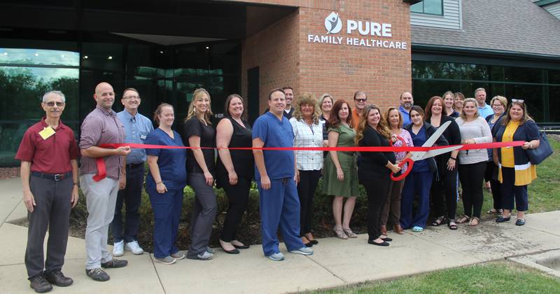 The staff of Pure Family Healthcare celebrate their opening with a ribbon cutting Wednesday, Sept. 8, 2021, co-hosted by the Crystal Lake, Cary-Grove area, Algonquin/Lake In the Hills, and Huntley chambers of commerce.
