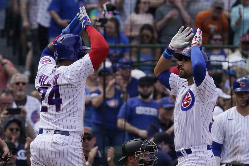Chicago Cubs' Alfonso Rivas, right, celebrates with Jonathan Villar after hitting a three-run home run against the Pittsburgh Pirates on Saturday, April 23, 2022 in Chicago.