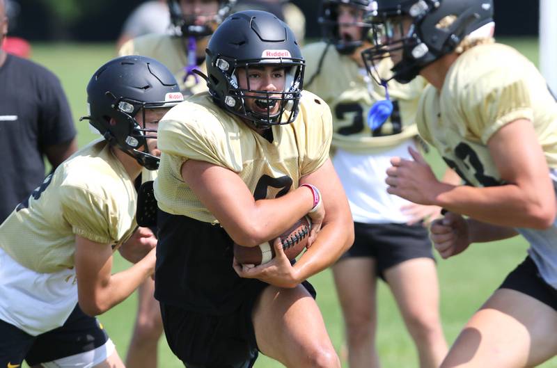Sycamore’s Diego Garcia carries the ball during practice Monday, July 17, 2023 at the school.