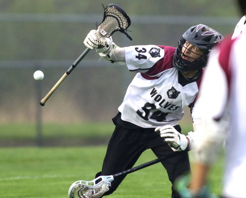 Prairie Ridge’s Travis Dittmer corrals the ball against Huntley in varsity boys lacrosse at Prairie Ridge  High School in Crystal Lake on Thursday, May 1, 2025.