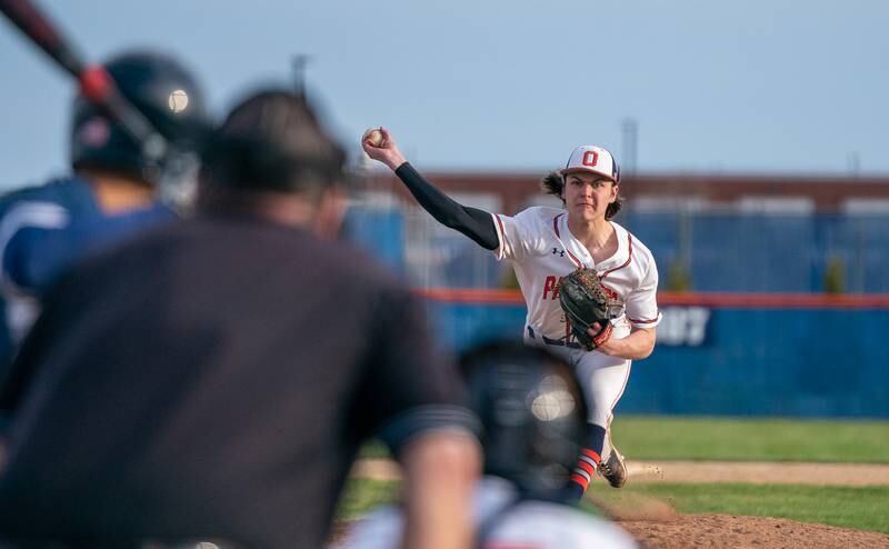 Oswego’s Andrew Hart (10) delivers a pitch against Plainfield South during a baseball game at Oswego High School on Monday, April 11, 2022.