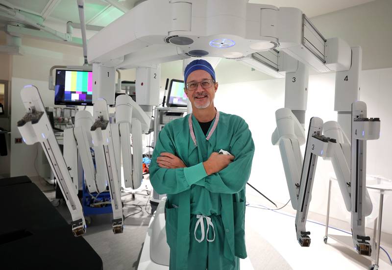 Dr. Jack Wagoner, associate chief medical officer at Northwestern Medicine Kishwaukee Hospital, with the da Vinci Xi robotic surgical system Tuesday, Oct. 28, 2025, in one of the operating rooms at the hospital in DeKalb. The hospital recently celebrated its 2,000th successful robotic-assisted surgery.