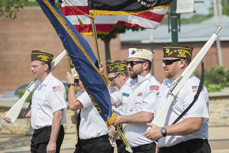 The VFW honor guard marches through the Dixon Memorial Day parade Monday, May 30, 2022 to Oakwood cemetery for a ceremony.