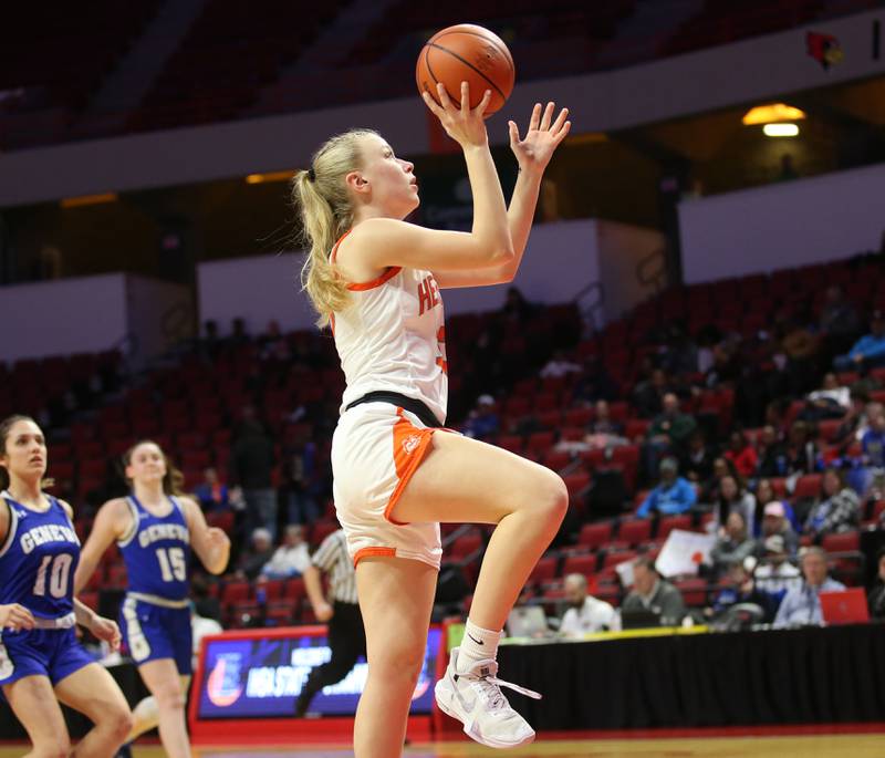 Hersey's Mackenzie Ginder runs in the lane all alone to score over Geneva's Peri Sweeney and Cassidy Arni during the Class 4A third place game on Friday, March 3, 2023 at CEFCU Arena in Normal.