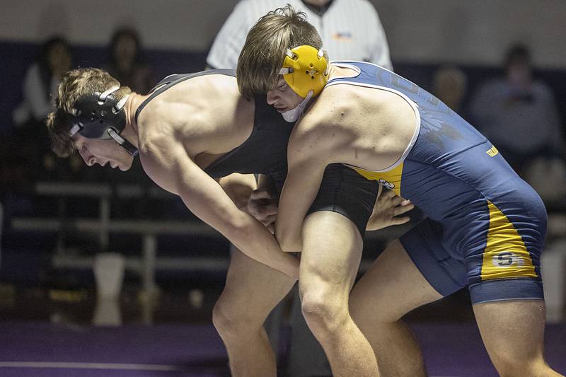 Dixon’s Steven Kitzman (left) and Sterling’s Gase Tate wrestle at 170 pounds Tuesday, Jan. 10, 2023. Kitzman won by pin.