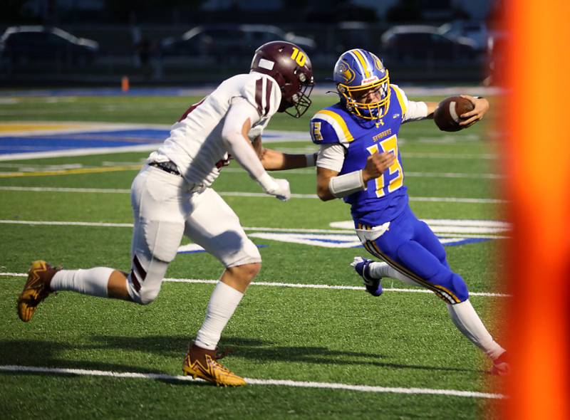 Richmond-Burton's Luke Robinson chases down Johnsburg's Carter Block during a Kishwaukee River Conference football game on Friday, Sept. 12, 2025, at Johnsburg High School.