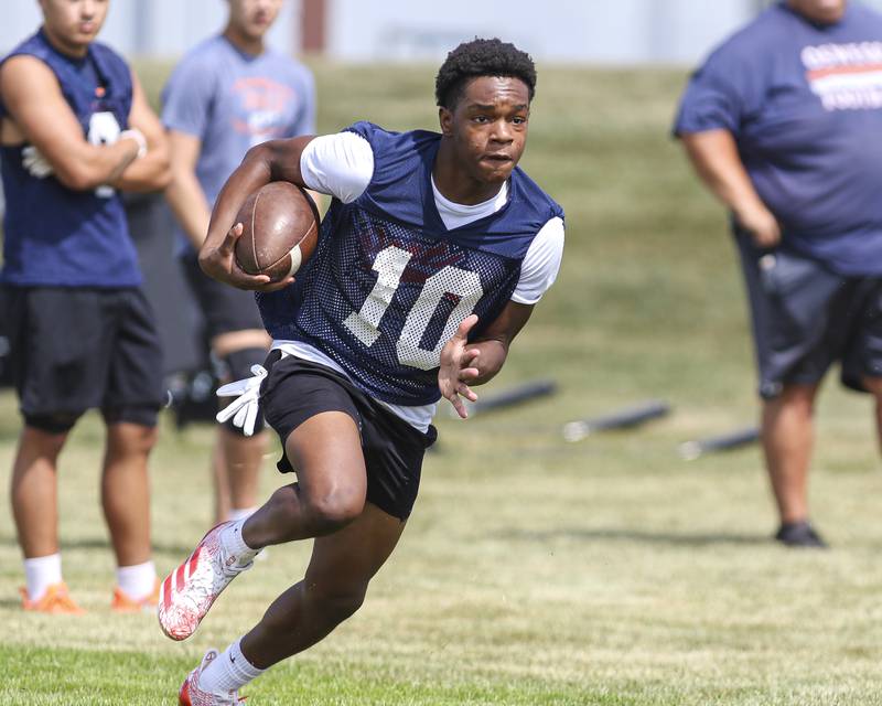 Jordan Walker runs with the ball at Oswego High School Football Practice, Monday, Aug 11, 2025  in Oswego.