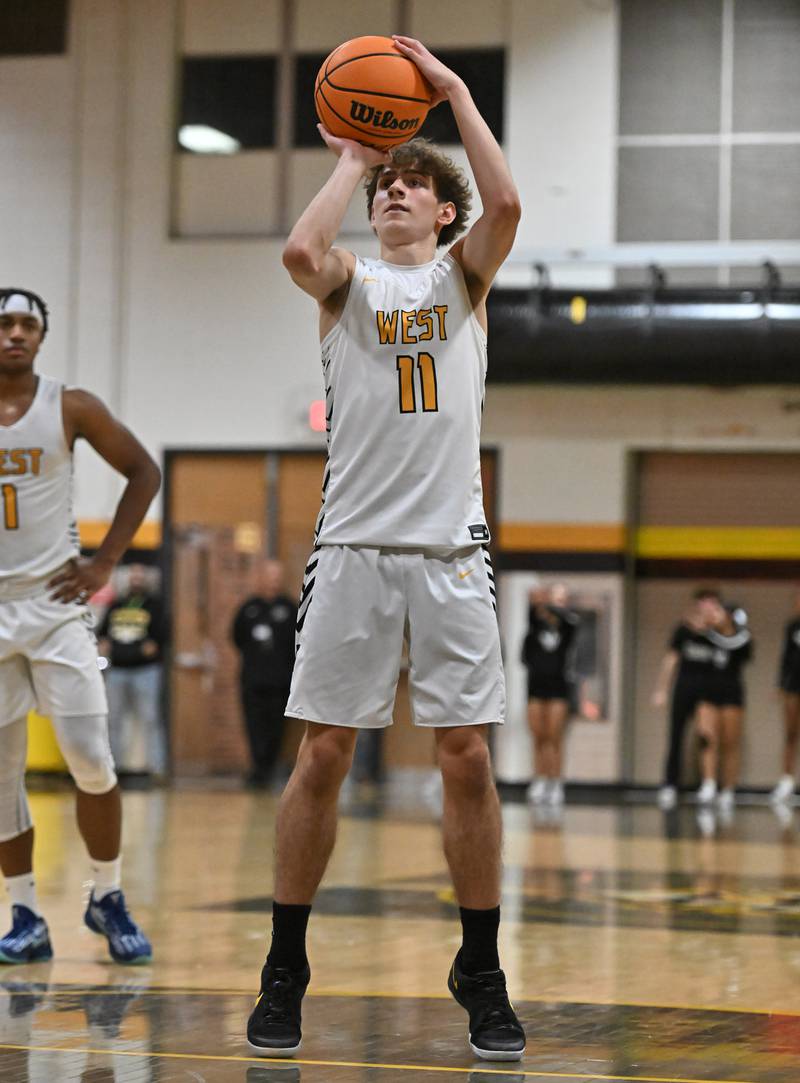 Joliet West's Luke Grevengoed (11) shoots a free throw shot during a conference game against Plainfield North on Friday, Dec. 20, 2024, at Joliet.