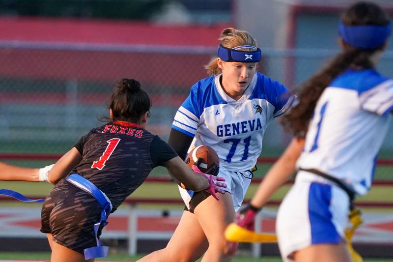 Geneva’s Sophie Peruba (71) runs after the catch against Yorkville's Ale Arriaga (1) during a non-conference game at Yorkville High School on Tuesday, Sept. 2, 2025.