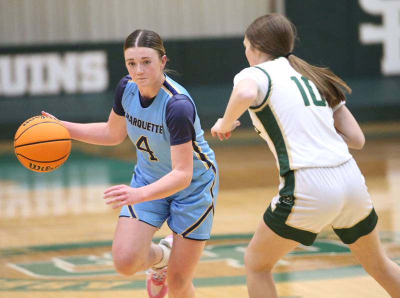 Marquette's Hunter Hopkins dribbles around St. Bede's Parker McClain on Monday, Dec. 2, 2024 at St. Bede Academy.