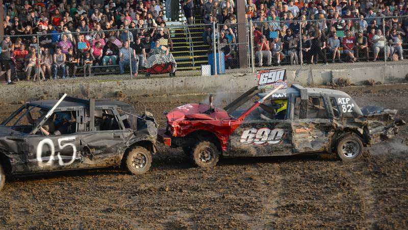 Abby Boss, 17, of Rock Falls, and her passenger, Travis, hit a another car during the Young Gun heat at the Ogle County Fair's demolition derby on Saturday, Aug. 2, 2025.