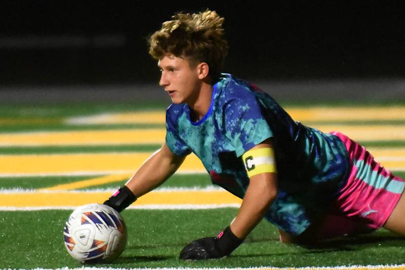 Coal City's Carter Nicholson covers up a save during a home game against Herscher Thursday, Oct. 2, 2025.