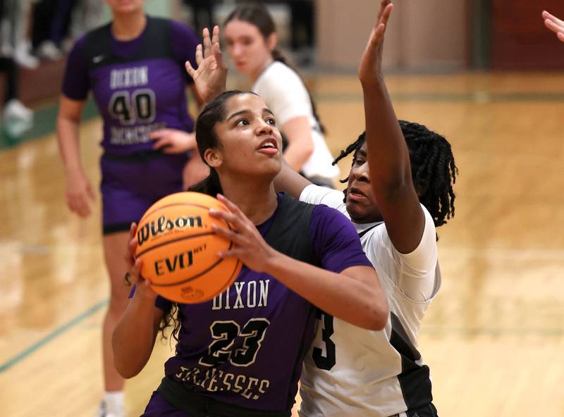 Dixon’s Ahmyrie McGowan looks to shoot over Kaneland's Amani Meeks during their Class 3A sectional semifinal game Tuesday, Feb. 25, 2025, at Boylan Catholic High School in Rockford.