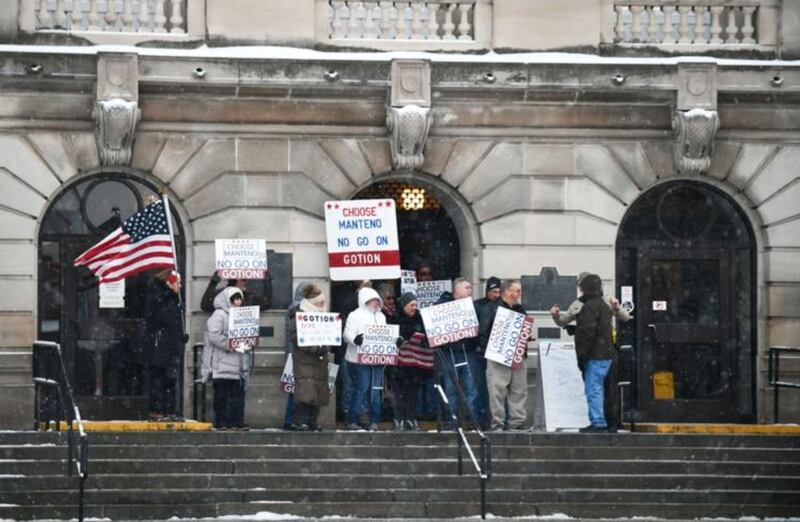 Members of the Concerned Citizens of Manteno gather outside the Kankakee County Courthouse for a demonstration Tuesday ahead of the hearing for their case against Gotion, the battery manufacturer opening in Manteno.