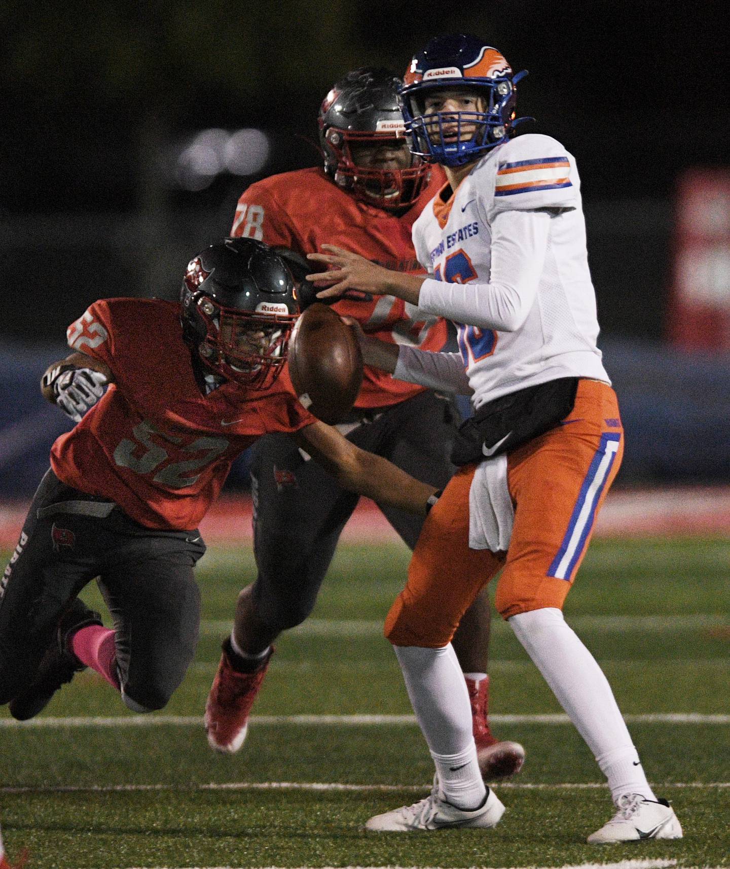 Palatine's Daevion Farrow rushes in to sack Hoffman Estates quarterback Aiden Cyr in a football game in Palatine on Friday, October 22, 2021.