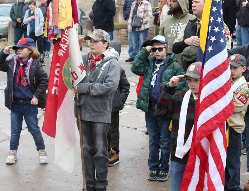 Boy Scouts and Cub Scouts salute Veterans during the 44th annual Pearl Harbor parade and memorial ceremony on Saturday, Dec. 2, 2023 in Peru.