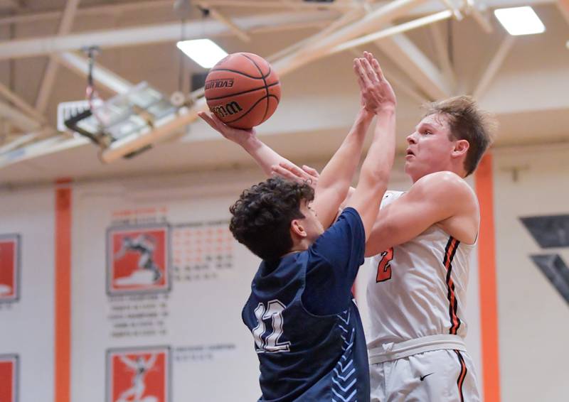 Wheaton Warrenville South's Jake Vozza (2) takes a shot over Lake Park's Joshua Gerber (12) during a game on Saturday, Jan. 7, 2023.