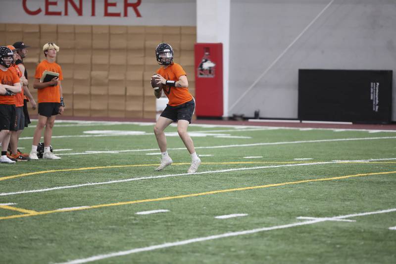 Senior quarterback Adrien McVicar drops back to pass the ball during a 7-on-7 tournament game on Sunday against Genoa-Kingston.