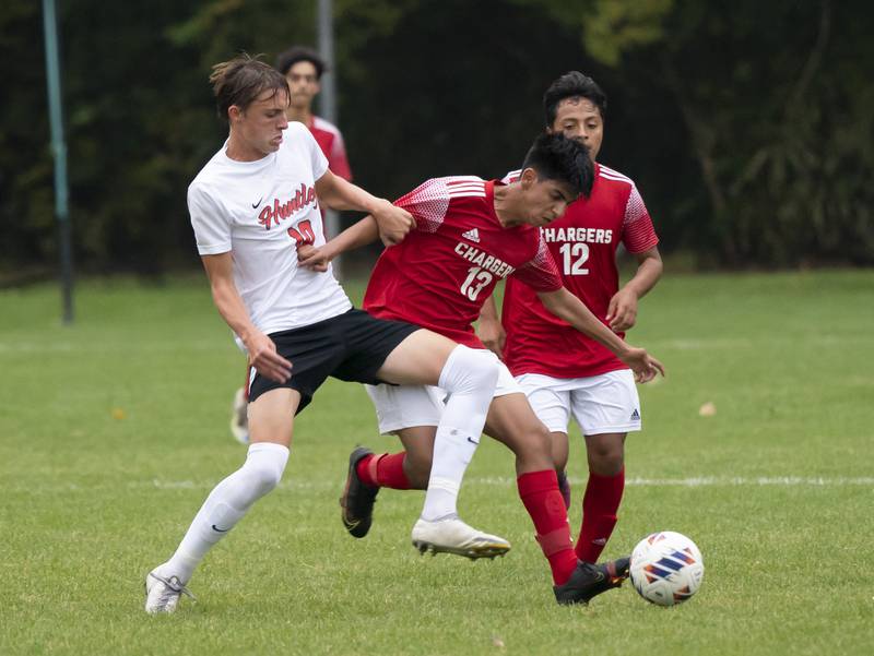 Huntley's Hudson Nielsen and Dundee-Crown's Christian Lechuga make a play for the ball during their game on Thursday, October 6, 2022 at Dundee-Crown High School in Carpentersville. Dundee-Crown won 1-0.