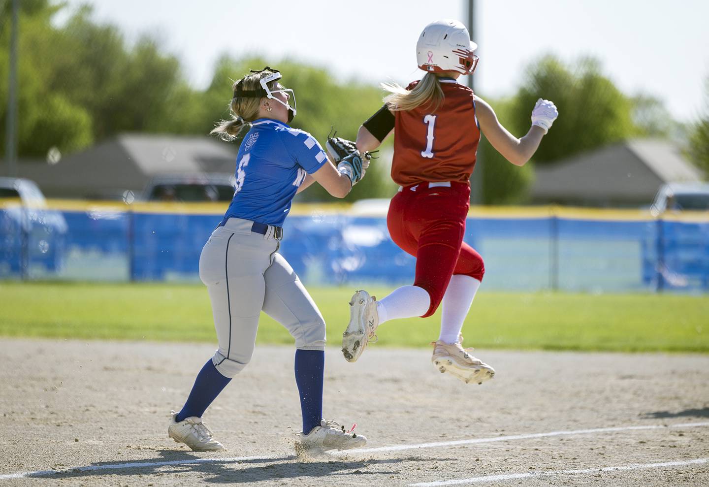 Newman’s Sam Ackman tags out Morrison’s Kaylee Pruis Friday, May 3, 2024 at Newman High School.