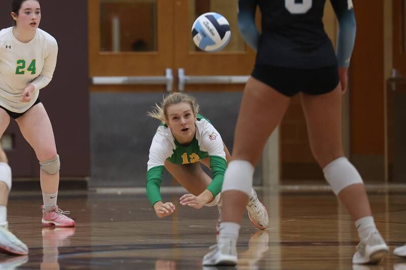Providence’s Payton Mandac makes a diving dig against Joliet Catholic on Thursday, Sept. 14, in Joliet.