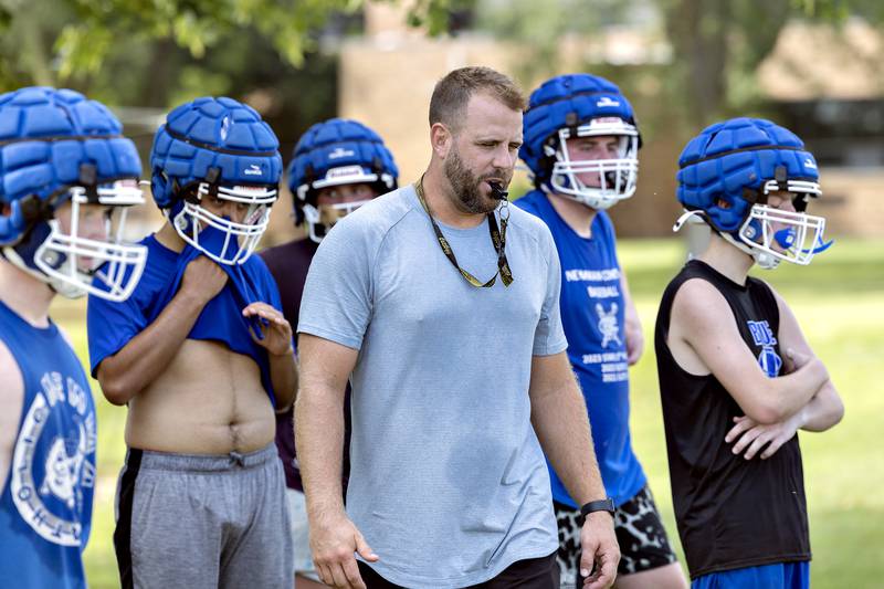 Newman coach Mike LeMay runs his team through drills Tuesday, August 12, 2025, at the high school. The team is gearing up for the 2025 season.