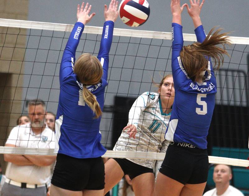 Woodstock North’s Lexi Hansen sends the ball over the net against Woodstock in varsity volleyball at Woodstock North Monday night.