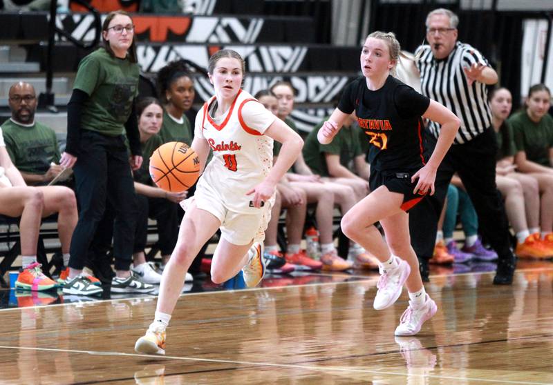 St. Charles East’s Kathlyn Bainbridge dribbles down court during a game against Batavia on Wednesday, Jan. 8, 2025 in St. Charles.