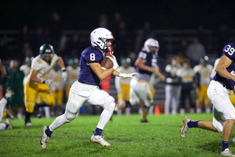 Gary - Grove's Andrew Prio runs for a gain against Crystal Lake South on Friday, Oct. 13 2023 in Cary Grove.